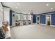 Spacious bonus room with built-in desks, custom cabinetry, plush carpet, and ample natural light at 266 Perfect Moment Dr, Durham, NC 27713
