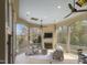 Inviting covered patio with stone fireplace, ceiling fans and outdoor seating for relaxation at 266 Perfect Moment Dr, Durham, NC 27713