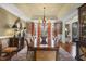 Stately dining room with large wood table, sideboard, and natural light at 266 Perfect Moment Dr, Durham, NC 27713