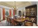 Formal dining room featuring a large wood table and elegant chandelier fixture at 266 Perfect Moment Dr, Durham, NC 27713
