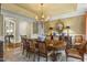Bright dining room features a large table and chairs, chandelier, and ample seating at 266 Perfect Moment Dr, Durham, NC 27713