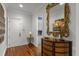 Foyer boasts wood floors, elegant decor and a glimpse into the laundry room at 266 Perfect Moment Dr, Durham, NC 27713