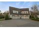 Spacious four-car garage featuring arched doorways and ample parking space, blending functionality with stylish design at 266 Perfect Moment Dr, Durham, NC 27713