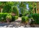 Stone walkway through manicured gardens leading toward home at 266 Perfect Moment Dr, Durham, NC 27713