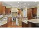 Spacious kitchen features custom cabinetry, stainless steel appliances, and granite countertops at 266 Perfect Moment Dr, Durham, NC 27713