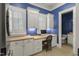 Bright laundry room features great cabinetry, countertop space, and backyard views at 266 Perfect Moment Dr, Durham, NC 27713