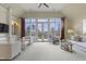 Spacious living room with high ceilings, french doors, comfortable seating, and ample light at 266 Perfect Moment Dr, Durham, NC 27713