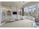 Bright living room features built-in shelving, fireplace, and French doors to balcony at 266 Perfect Moment Dr, Durham, NC 27713