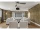 Cozy media room with projector screen, comfortable seating, and custom built-in storage cabinets at 266 Perfect Moment Dr, Durham, NC 27713