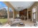 Spacious covered patio with a fully equipped outdoor kitchen and comfortable seating at 266 Perfect Moment Dr, Durham, NC 27713