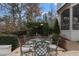 Charming outdoor seating area with glass table, ideal for relaxing in the garden at 266 Perfect Moment Dr, Durham, NC 27713
