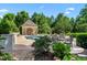Stunning pool area featuring a gazebo, elegant outdoor furniture, and lush landscaping for luxurious relaxation at 266 Perfect Moment Dr, Durham, NC 27713