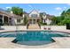 Resort-style pool area with a large in-ground pool, elegant patio furniture, and beautifully landscaped grounds at 266 Perfect Moment Dr, Durham, NC 27713