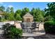 Beautiful outdoor pool area with elegant furniture, covered seating, and lush landscaping creating a tranquil setting at 266 Perfect Moment Dr, Durham, NC 27713