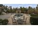 Inviting backyard pool area with a charming cabana, ample seating, and lush landscaping, perfect for outdoor entertaining at 266 Perfect Moment Dr, Durham, NC 27713