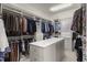 Large walk-in closet with custom shelving, drawers, and ample storage space at 266 Perfect Moment Dr, Durham, NC 27713