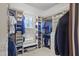 Well-organized walk-in closet with custom shelving, hanging rods, and a window seat at 266 Perfect Moment Dr, Durham, NC 27713