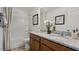 Bathroom featuring a double vanity with granite countertop, bathtub, and shower combination at 266 Sweetbay Tree Dr, Wendell, NC 27591
