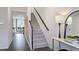 View of a foyer with staircase, decor table with mirror, and a glimpse of a living room at 266 Sweetbay Tree Dr, Wendell, NC 27591