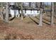 Backyard view featuring mature trees and fenced area providing space for outdoor activities at 309 Cody St, Durham, NC 27703