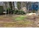 The backyard features fencing and mature shade trees at 309 Cody St, Durham, NC 27703