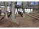 Backyard view featuring a house with a fenced yard surrounded by mature trees at 309 Cody St, Durham, NC 27703