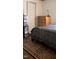 Bedroom featuring carpet, a bed with comforter, and a wooden dresser at 309 Cody St, Durham, NC 27703