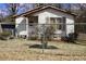 A charming one-story home with a cozy front porch and fenced yard, inviting comfort and security at 309 Cody St, Durham, NC 27703