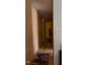 Hallway with neutral walls and hardwood floors; rugs scattered on the floor at 309 Cody St, Durham, NC 27703