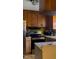 Bright kitchen features stainless steel appliances, wooden cabinets and green backsplash at 309 Cody St, Durham, NC 27703