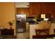 Kitchen with wood cabinets, stainless steel refrigerator, and breakfast area at 309 Cody St, Durham, NC 27703