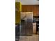Kitchen featuring stainless steel refrigerator, wooden cabinets and laminate countertops at 309 Cody St, Durham, NC 27703