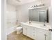 Bright bathroom featuring a double vanity, shower and tub combo, and tile floors at 4 Birkdale Ct, Durham, NC 27713