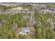 Expansive aerial view of a stately home nestled within a dense, lush forest at 419 Eagle Point Rd, Pittsboro, NC 27312