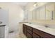 Bathroom features double sinks with vanities and a separate tub and shower at 419 Eagle Point Rd, Pittsboro, NC 27312