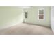 Bright bedroom with two windows allowing natural light to fill the room at 419 Eagle Point Rd, Pittsboro, NC 27312