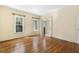 Bedroom features hardwood floors, neutral walls, multiple windows for natural light, and glass doors at 419 Eagle Point Rd, Pittsboro, NC 27312