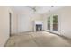 Bedroom featuring carpet flooring, a cozy fireplace, and access to an outdoor deck at 419 Eagle Point Rd, Pittsboro, NC 27312