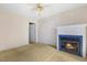 Bedroom with a fireplace, closet, and ceiling fan providing comfort and storage at 419 Eagle Point Rd, Pittsboro, NC 27312