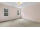 Bedroom featuring two windows and light colored walls at 419 Eagle Point Rd, Pittsboro, NC 27312