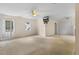 Large bonus room with carpet flooring, ceiling fans, and great natural lighting through multiple windows at 419 Eagle Point Rd, Pittsboro, NC 27312