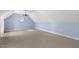 Spacious bonus room features high ceilings, natural light, and neutral carpeting at 419 Eagle Point Rd, Pittsboro, NC 27312