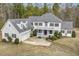 Two-story home featuring white siding, black shutters, a red door, and an attached two-car garage at 419 Eagle Point Rd, Pittsboro, NC 27312