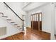 Bright foyer boasts hardwood floors, staircase, and elegant front door with glass detailing at 419 Eagle Point Rd, Pittsboro, NC 27312