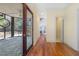 Hallway with access to sun room, and an adjacent living space with lots of natural light at 419 Eagle Point Rd, Pittsboro, NC 27312