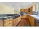 Bright kitchen with a large center island, stainless steel appliances, and hardwood flooring at 419 Eagle Point Rd, Pittsboro, NC 27312