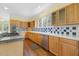 Kitchen showcasing wood cabinets, stainless steel appliances, and hardwood flooring at 419 Eagle Point Rd, Pittsboro, NC 27312