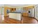 Charming kitchen featuring natural wood cabinets, stainless steel appliances, and hardwood flooring at 419 Eagle Point Rd, Pittsboro, NC 27312