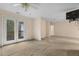 Open living room leads to a balcony with natural light and access to additional rooms at 419 Eagle Point Rd, Pittsboro, NC 27312