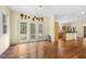 Bright living room open to kitchen featuring glass doors to the backyard and hardwood floors at 419 Eagle Point Rd, Pittsboro, NC 27312